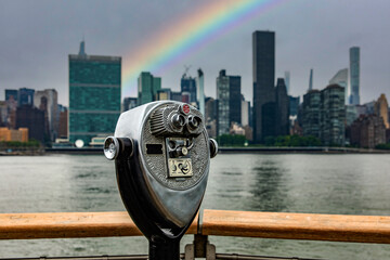 The Manhattan skyline with a rainbow seen with a Long Island prism, which is an island that extends...