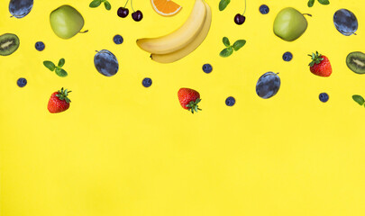 Fruit and berry on the yellow background. Copy space. Top view.