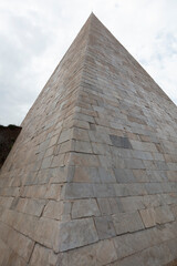Italy Rome Pyramid of Cestius on a cloudy spring day