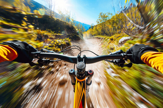 Rider driving bicycle on an mountain road. Motion blurred background.