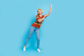 Full size photo of nice woman dressed knit t-shirt dancing in headphones look at sale empty space...