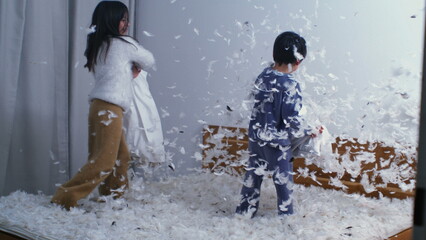 Siblings Joyful Pillow Battle - Feathers in the Air, Captured in Slow Motion at 1000 FPS