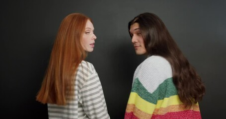 Beautiful long Hair Funny smiling woman, man with luxurious straight hair turn back around look at camera Guy showing two fingers Victory gesture Hairstyle cure extensions slow motion hair care Beauty