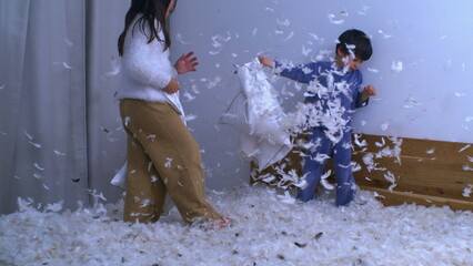 Pillow Battle Extravaganza - Siblings Engaging in Playful Fight, Feathers Fluttering in High-Speed...