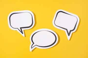 Group of three Blank Speech Bubble isolated on yellow background. Mock up template