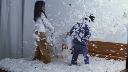 Siblings Joyful Pillow Battle - Feathers in the Air, Captured in Slow Motion at 1000 FPS