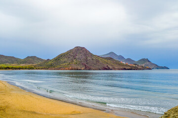 Panoramic view of Cabo de Gata with its beaches, sea, blue sky and mountains in the background