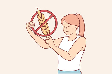 Woman holds gluten-free sign, urging people to stop eating foods containing grains and wheat