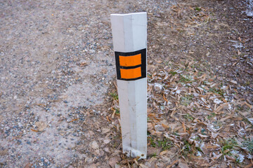 Orange barrels, barricades, and signs blocking a road