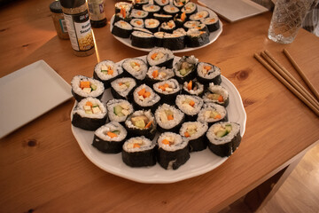 Fresh Homemade Sushi Roll against old wooden table.