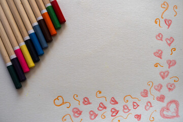 Hand Drawn Red Heart Photograph Row of Multicolored Pencils on White Background