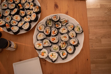 Fresh Homemade Sushi Roll against old wooden table.