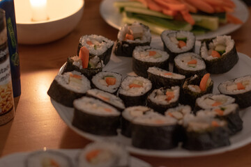 Fresh Homemade Sushi Roll against old wooden table.