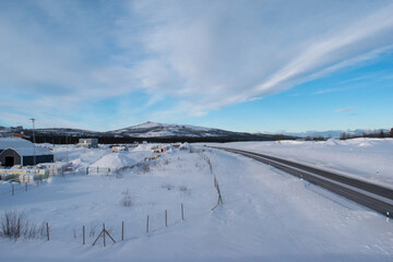 Snow covered road in arctic winter in Lapland, Sweden