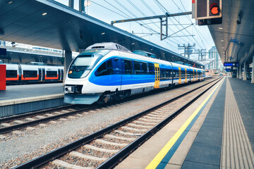 High speed train at the railway station in Vienna, Austria. Beautiful blue modern intercity...