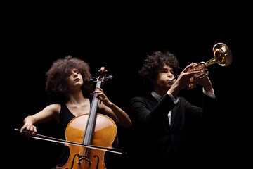 Female artist playing a cello and a male artist playing a trumpet © Ljupco Smokovski