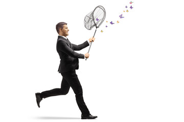 Businessman running and catching butterflies with a net