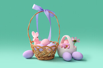 Baskets with painted Easter eggs, toy bunny and chrysanthemum flowers on turquoise background