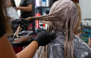 discoloration of a client in a hair salon, hair salon concept