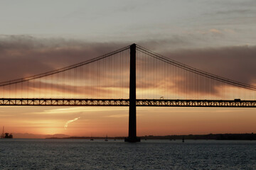 Fototapeta na wymiar Lisbon 25th (Ponte 25 de Abril) Tejo River Sunset