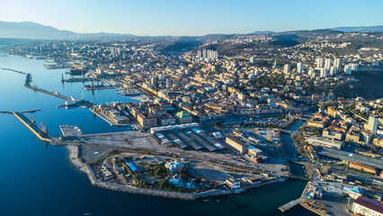Breathtaking aerial view of Rijeka, Croatia, as a ship is being unloaded in the bustling port 