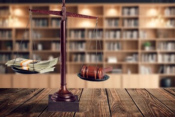 Wooden desk in courtroom, money and material concept