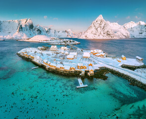 Lofoten islands beautiful nature landscape in Norway and fishing town with scenic yellow rorbu houses of Sakrisoy, Reine - 740283246