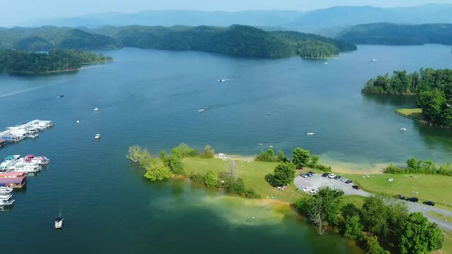 South Holston lake aerial view of boats on lake with Appalachian mountains behind
