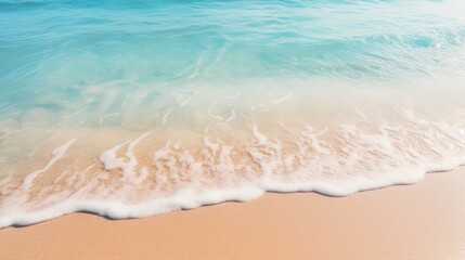 Fototapeta na wymiar Tranquil Coastal Scene: Soft Wave Caressing Sandy Beach under Clear Summer Sky