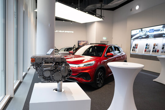 innovative electric motor BYD Electric against background of red BYD ATTO 3, traction electric motor Chinese manufacturer, high torque, Innovation automotive industry, Frankfurt - January 31, 2024
