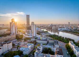 Yekaterinburg city and pond aerial panoramic view at summer sunset.