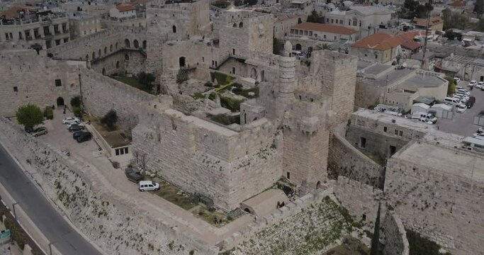 Aerial Footage of the Tower of David, the walls of the Old City and the Old City of Jerusalem.