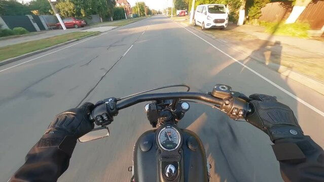  KIEV, Ukraine - 04 09 2021: Top view of man riding motorcycle, POV of motor biker on open road, Motorcyclist, Motorbike ride, 