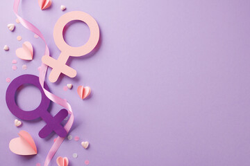 Honoring the spectrum of womanhood: strength in every shade. Top view of interlocked female gender symbols, confetti, ribbon on purple background with space for celebratory message and acknowledgments
