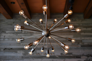 Contemporary chandelier with polished nickel arms and exposed bulbs