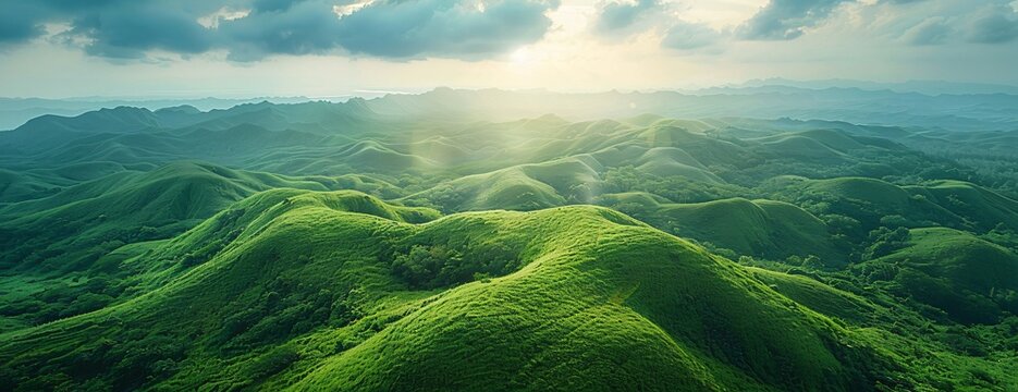 Lush green rolling hills under vibrant sky sun casting soft glow over landscape