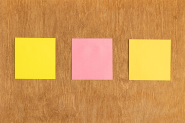Sticky notes on a wooden wall