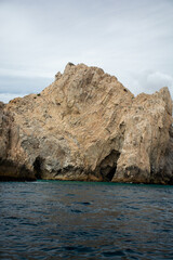 Fototapeta na wymiar View of the Arch in Los Cabos, Baja California, Mexico. The Cabo Arch on a cloudy winter day.
