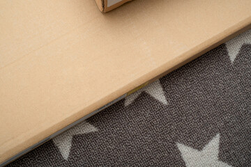 Cardboard box of new furniture set on floor.  Copy Space