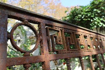 corroded wrought iron fence , old metal ornaments