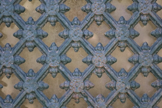 ancient rusty wrought ornamented metal surface