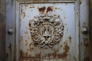 ancient rusty wrought ornamented metal surface