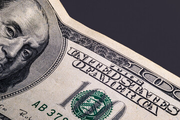 Close-up detail photograph of the US dollar. Benjamin, $100 bill. Business and finance concept.