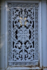wrought iron ornaments , ancient metal fence closeup