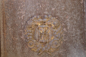 wrought iron ornaments , ancient metal fence closeup