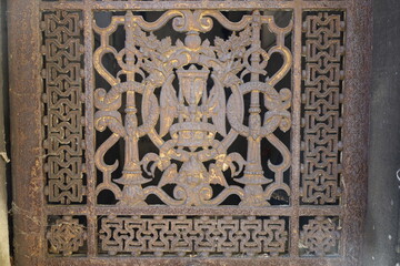 wrought iron ornaments , ancient metal fence closeup