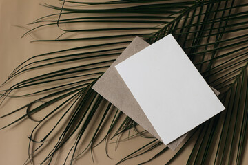 Summer tropical wedding stationery still life scene. Green date palm leaves. Blank greeting card,...
