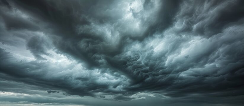 The atmosphere is filled with grey clouds, creating a stormy sky with cumulus formations. The horizon blends into the natural landscape as wind stirs the water below