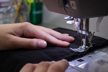 Woman sewing in a close up