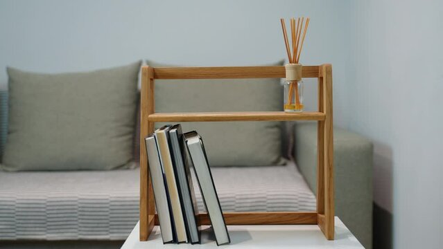 Handmade craft bookshelf with books in a home interior